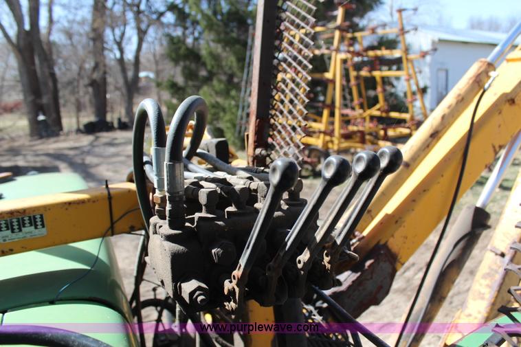 image for item H6218 1980 John Deere 2940 MFWD tractor with boom mower