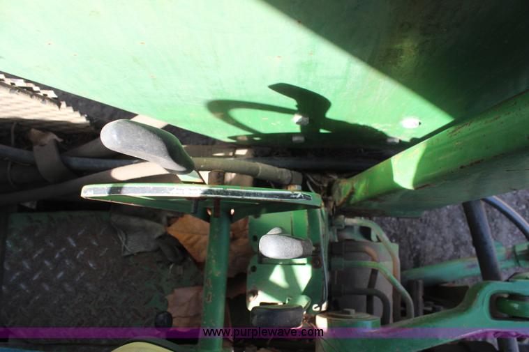 image for item H6218 1980 John Deere 2940 MFWD tractor with boom mower