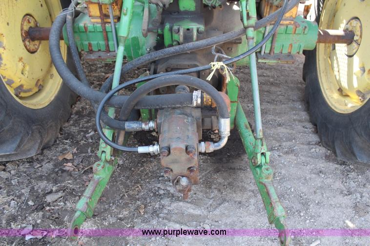 image for item H6218 1980 John Deere 2940 MFWD tractor with boom mower