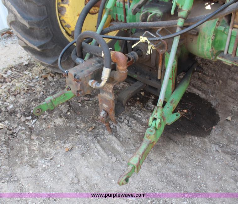 image for item H6218 1980 John Deere 2940 MFWD tractor with boom mower