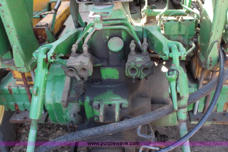 image for item H6218 1980 John Deere 2940 MFWD tractor with boom mower