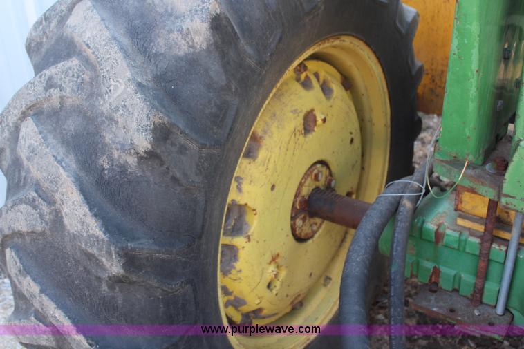 image for item H6218 1980 John Deere 2940 MFWD tractor with boom mower