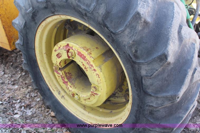 image for item H6218 1980 John Deere 2940 MFWD tractor with boom mower