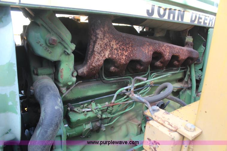 image for item H6218 1980 John Deere 2940 MFWD tractor with boom mower