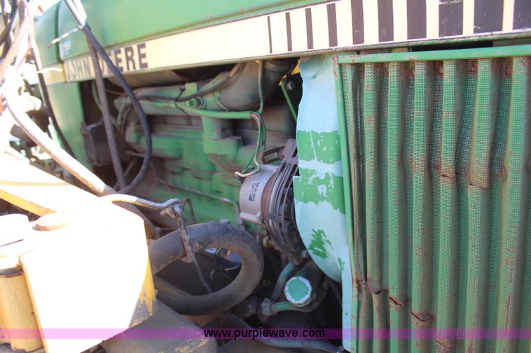 image for item H6218 1980 John Deere 2940 MFWD tractor with boom mower