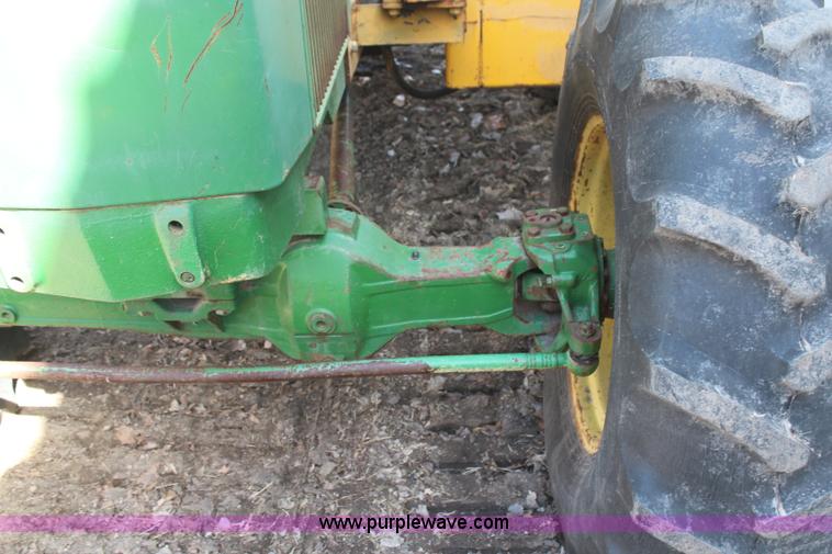 image for item H6218 1980 John Deere 2940 MFWD tractor with boom mower