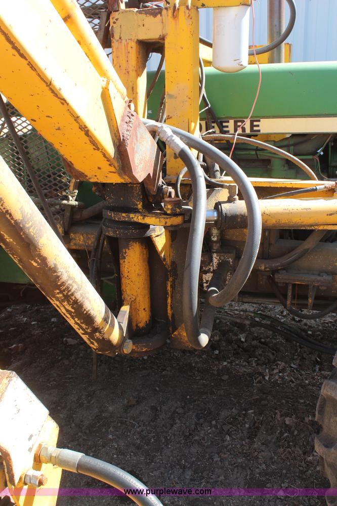 image for item H6218 1980 John Deere 2940 MFWD tractor with boom mower