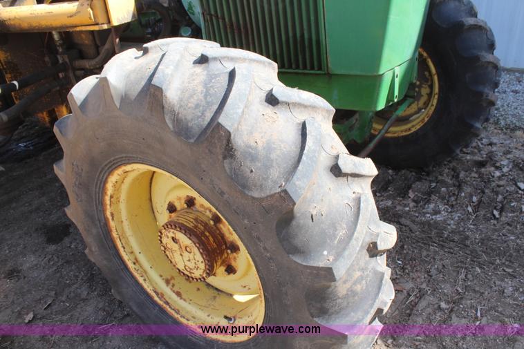 image for item H6218 1980 John Deere 2940 MFWD tractor with boom mower