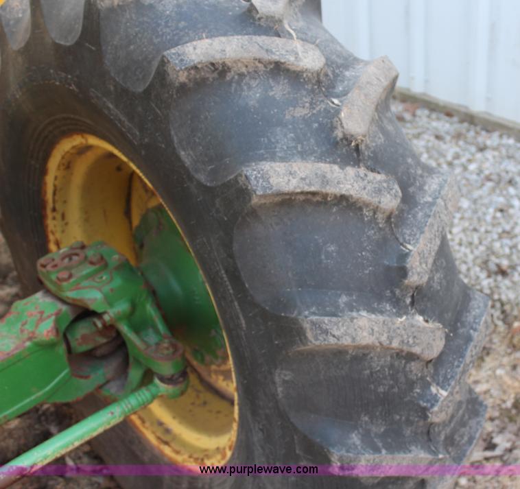 image for item H6218 1980 John Deere 2940 MFWD tractor with boom mower