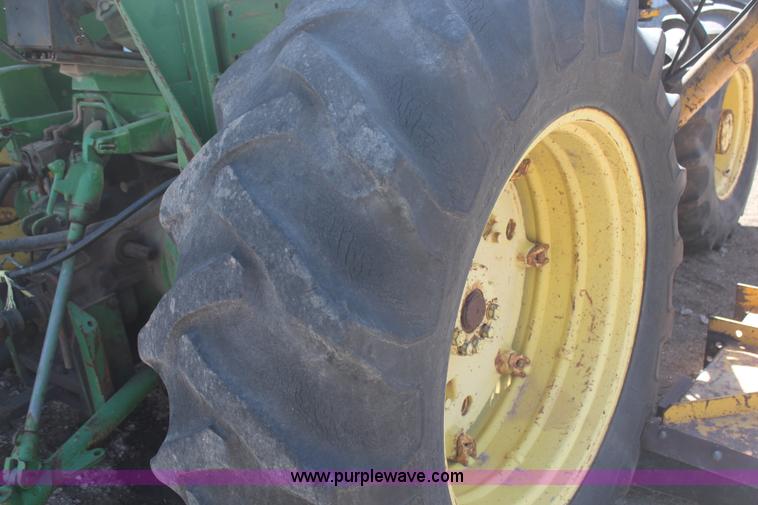 image for item H6218 1980 John Deere 2940 MFWD tractor with boom mower