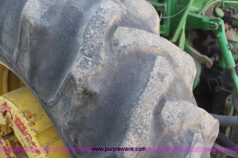 image for item H6218 1980 John Deere 2940 MFWD tractor with boom mower