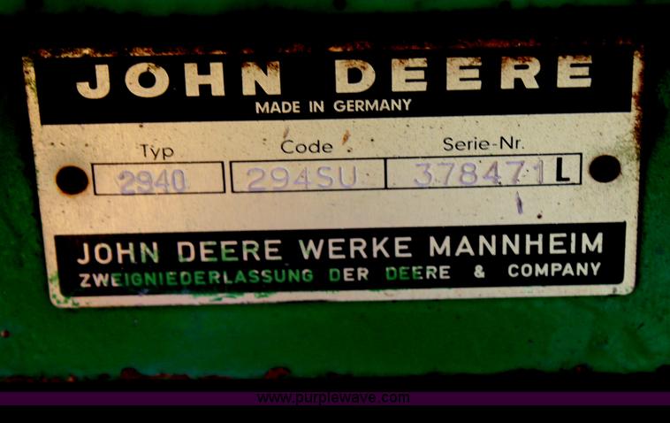 image for item H6218 1980 John Deere 2940 MFWD tractor with boom mower