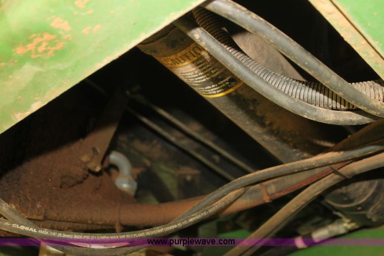 image for item H2147 2004 John Deere 4895 self-propelled swather