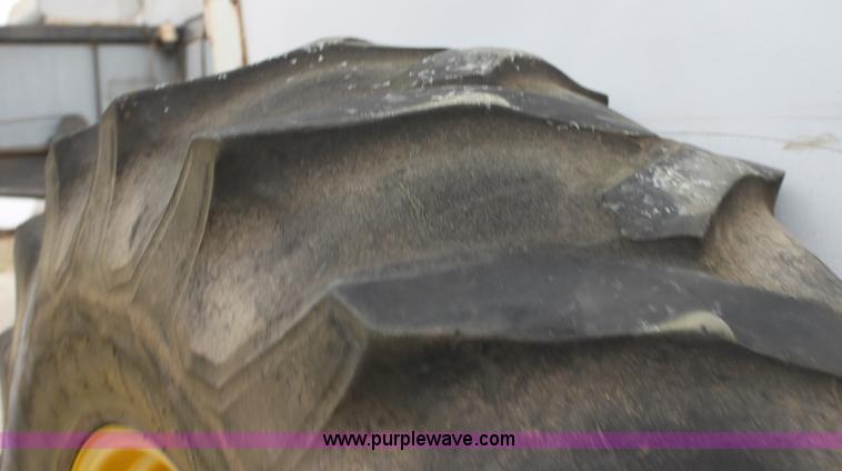 image for item H2175 (2) Firestone 20.8-34 rear tractor tires and John Deere wheels