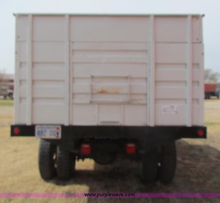 image for item H2211 2004 GMC C6500 grain truck