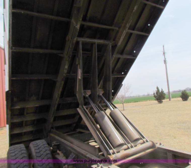 image for item H2211 2004 GMC C6500 grain truck