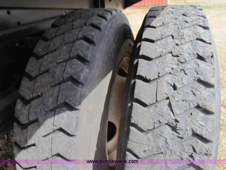 image for item H2211 2004 GMC C6500 grain truck