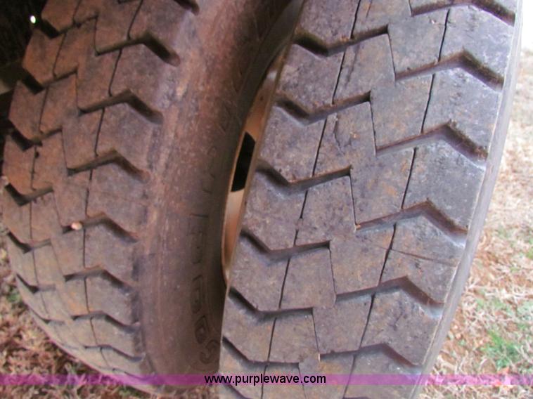 image for item H2211 2004 GMC C6500 grain truck