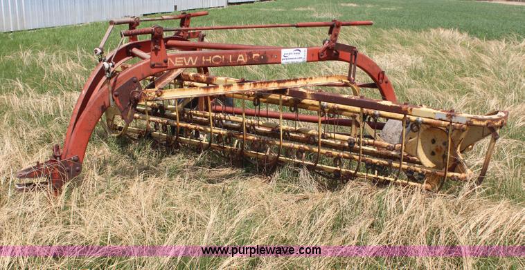 image for item H6100 New Holland 256 side delivery rake