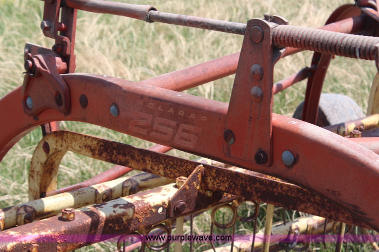 image for item H6100 New Holland 256 side delivery rake