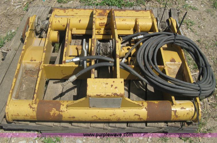 image for item AX9767 Caterpillar quick attach loader coupler