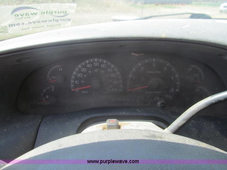 image for item I7124 2003 Ford F150 XLT flatbed pickup truck