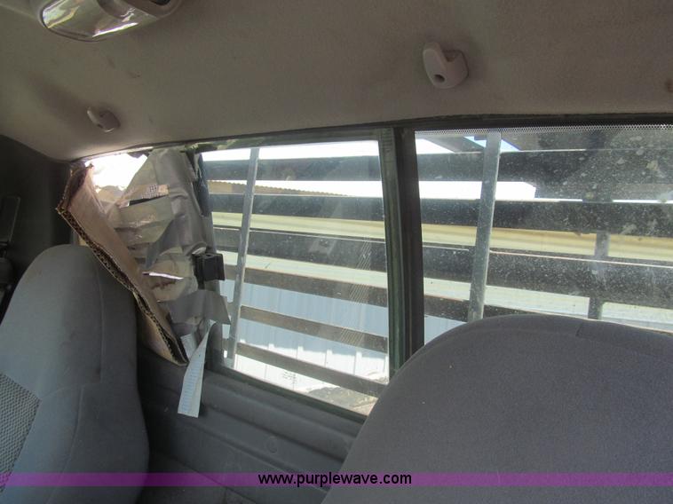 image for item I7124 2003 Ford F150 XLT flatbed pickup truck