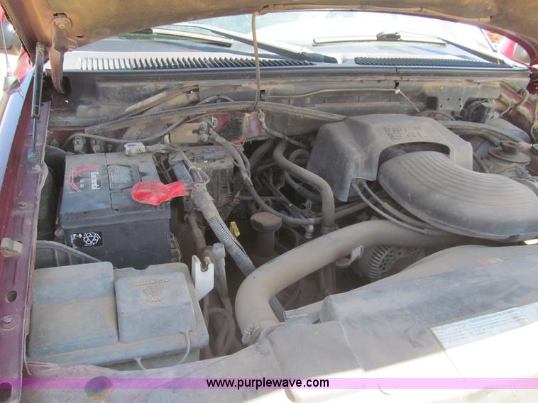 image for item I7124 2003 Ford F150 XLT flatbed pickup truck