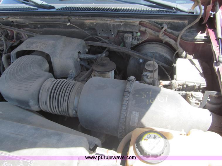 image for item I7124 2003 Ford F150 XLT flatbed pickup truck