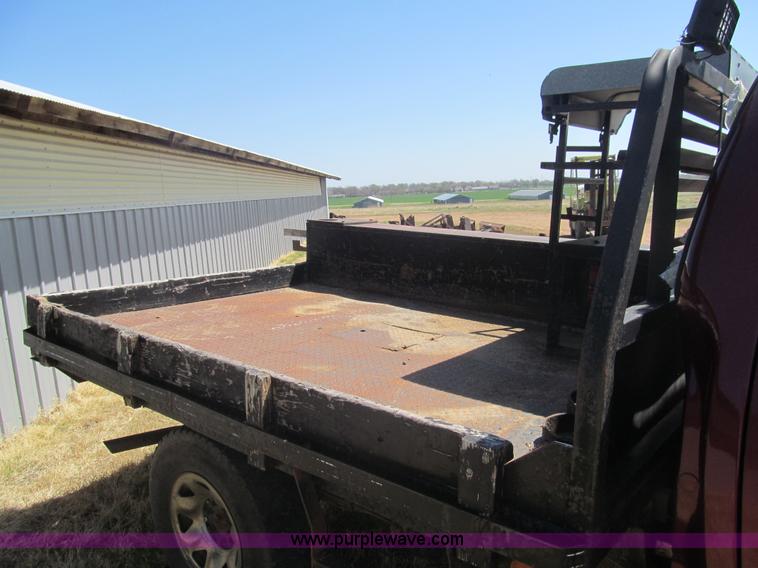 image for item I7124 2003 Ford F150 XLT flatbed pickup truck