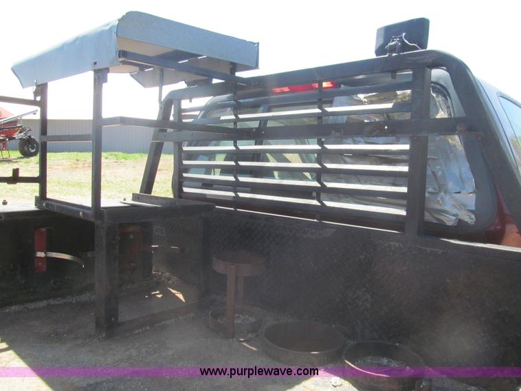 image for item I7124 2003 Ford F150 XLT flatbed pickup truck