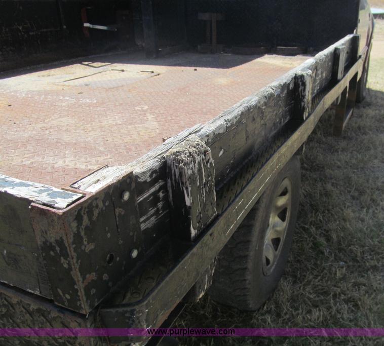 image for item I7124 2003 Ford F150 XLT flatbed pickup truck