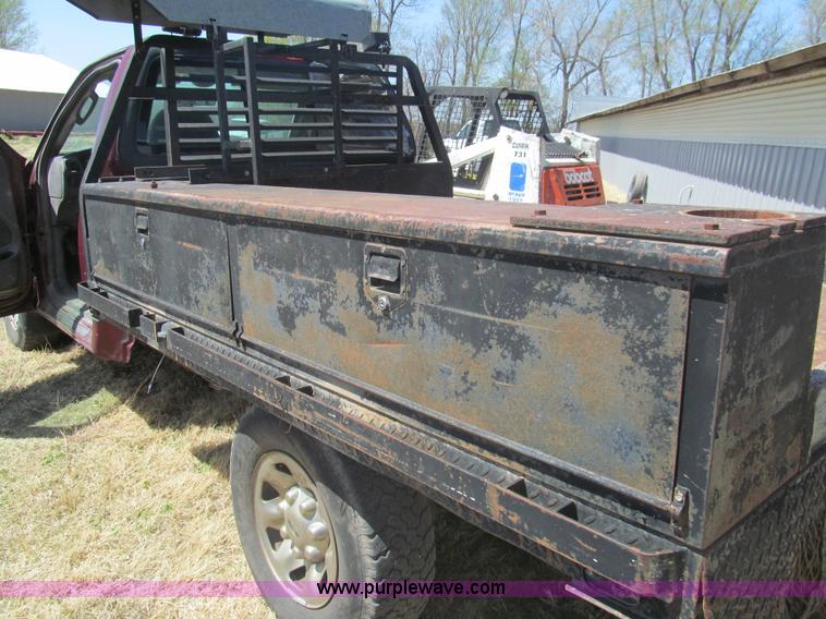 image for item I7124 2003 Ford F150 XLT flatbed pickup truck