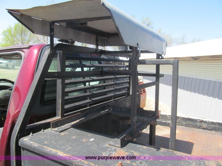 image for item I7124 2003 Ford F150 XLT flatbed pickup truck