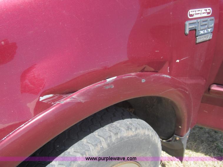 image for item I7124 2003 Ford F150 XLT flatbed pickup truck