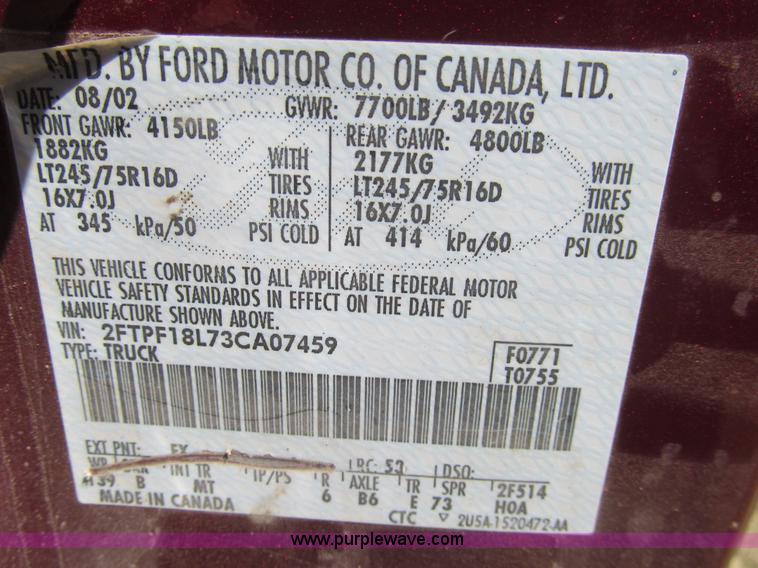 image for item I7124 2003 Ford F150 XLT flatbed pickup truck