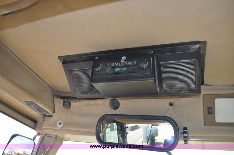 image for item G6454 1998 John Deere 770CH articulated motor grader