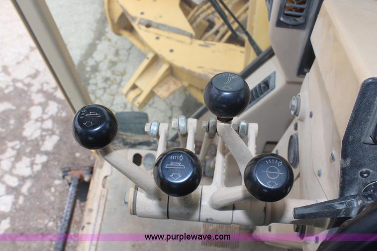 image for item H1421 1998 Caterpillar 140H articulated motor grader