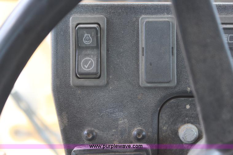 image for item H1421 1998 Caterpillar 140H articulated motor grader