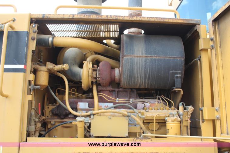 image for item H1421 1998 Caterpillar 140H articulated motor grader