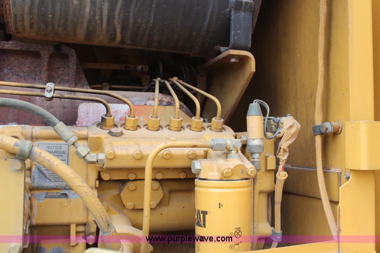 image for item H1421 1998 Caterpillar 140H articulated motor grader