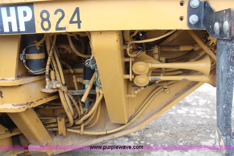 image for item H1421 1998 Caterpillar 140H articulated motor grader