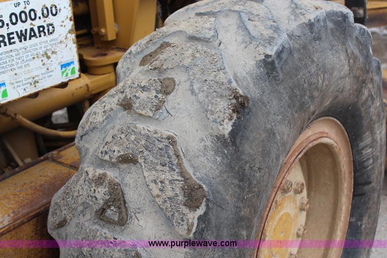 image for item H1421 1998 Caterpillar 140H articulated motor grader