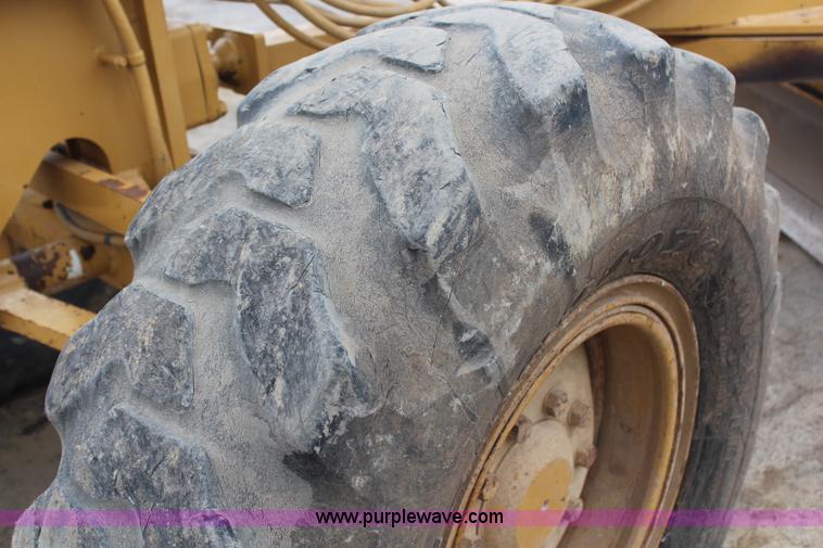 image for item H1421 1998 Caterpillar 140H articulated motor grader