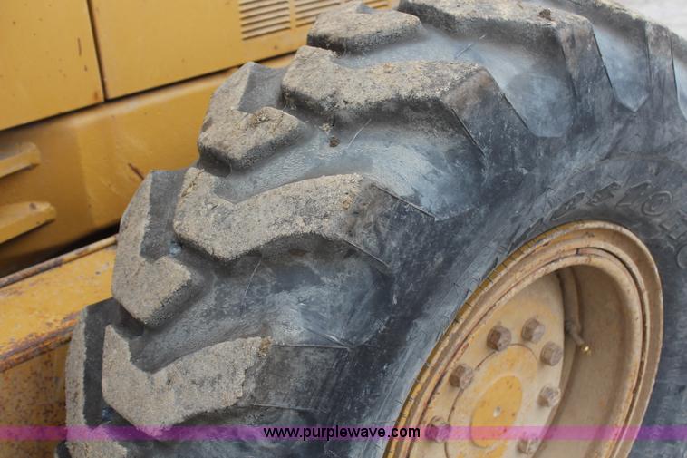 image for item H1421 1998 Caterpillar 140H articulated motor grader