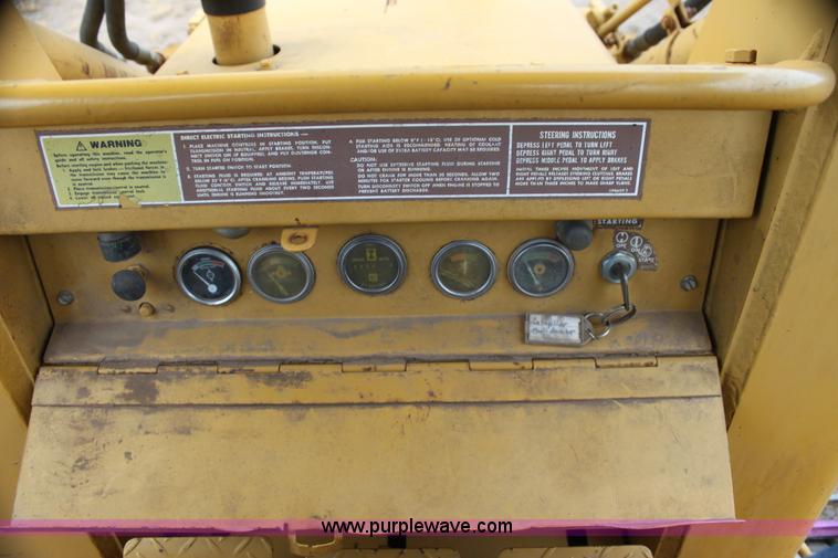 image for item H2112 1979 Caterpillar 931 track loader with backhoe attachment