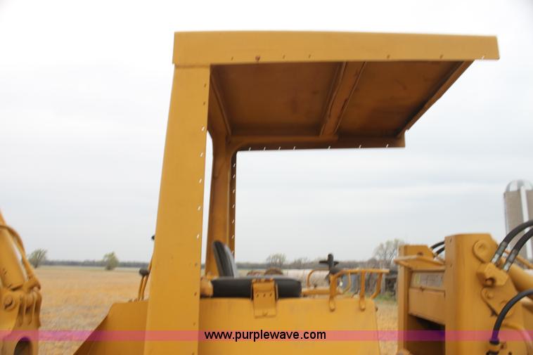 image for item H2112 1979 Caterpillar 931 track loader with backhoe attachment