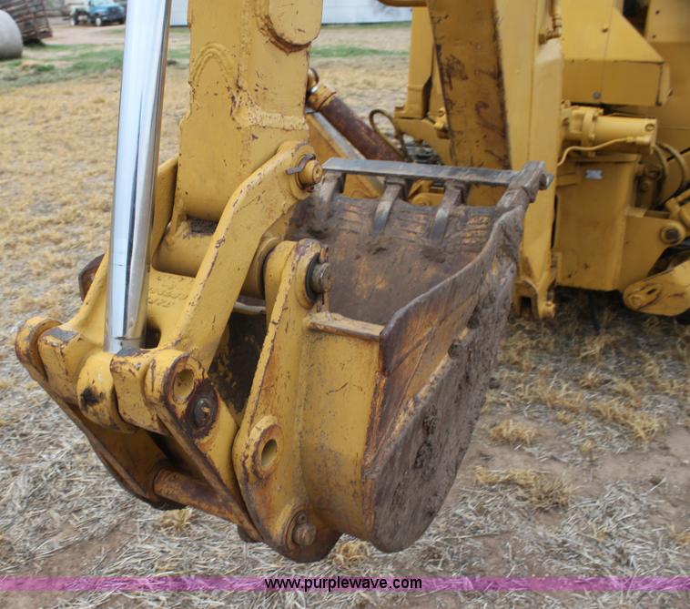 image for item H2112 1979 Caterpillar 931 track loader with backhoe attachment