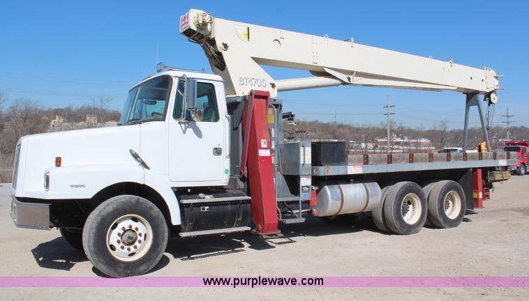 image for item H6004 2001 Volvo WG64 flatbed truck with Terex boom