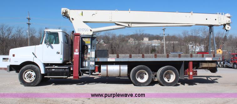 image for item H6004 2001 Volvo WG64 flatbed truck with Terex boom